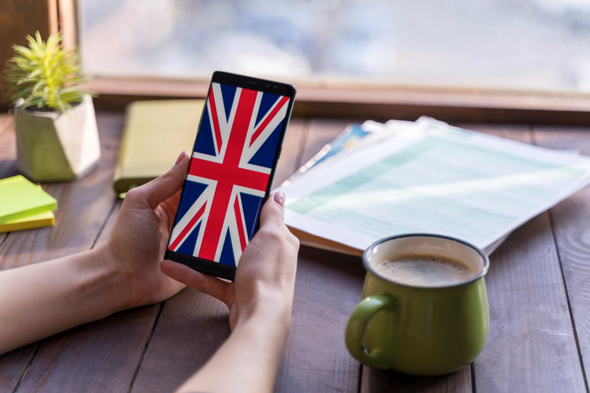 Close up woman with smartphone coffee cup